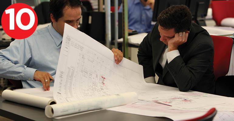 Architects look at blueprints at the World Trade Center