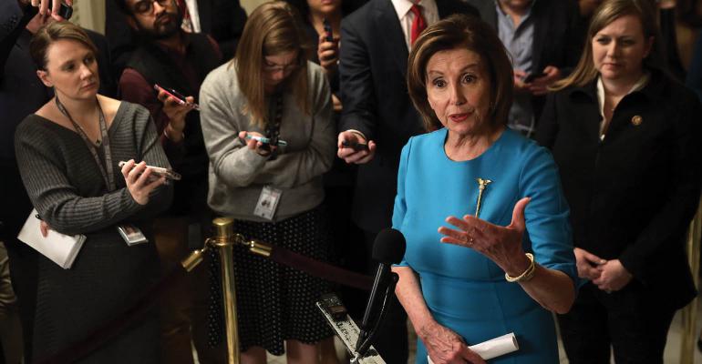 Pelosi held a briefing on the Coronavirus Aid Package Bill that will deal with the outbreak of COVID-19. Photo by Alex Wong Getty Images.jpg
