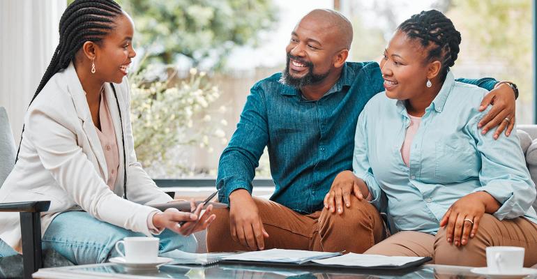 Black couple meeting with an advisor Black History Month financial advice