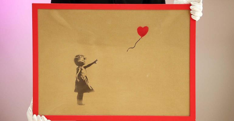 Banksy painting girl with balloon