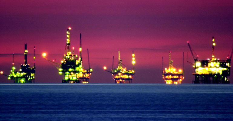 oil-rigs-sunset-getty