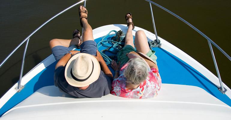 overhead shot of retirees sitting on a boat