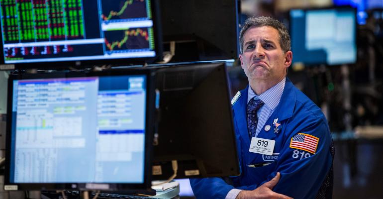 stock market trader frowning