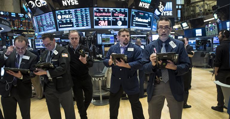 stock market traders standing
