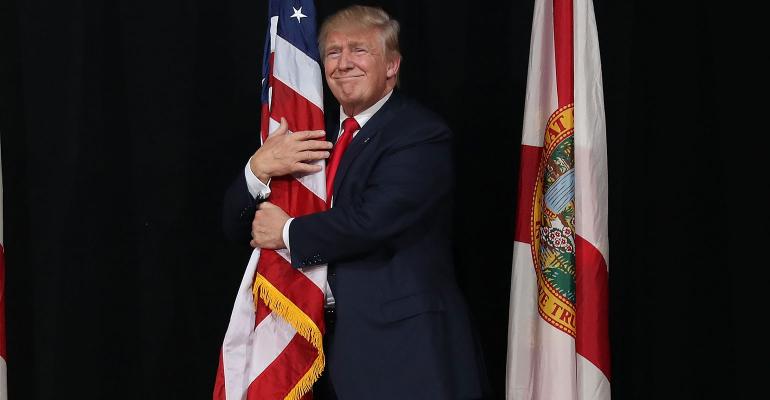 Trump hugging flag