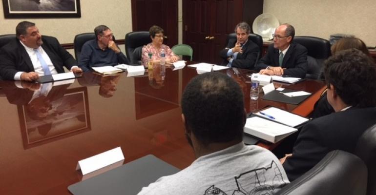 Sherrod Brown and Tom Perez at a roundtable discussion Monday in Cleveland 
