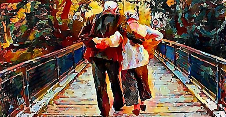 elderly couple crossing bridge