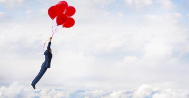 businessman-balloons-flying.jpg