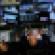 stock market trader crowded desk screens monitors