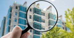 apartment building magnifying glass
