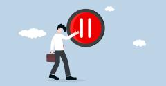 illustration of businessman pressing pause button