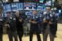 stock market traders standing