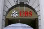 UBS Cuts Costs and Heads, But Hires FAs